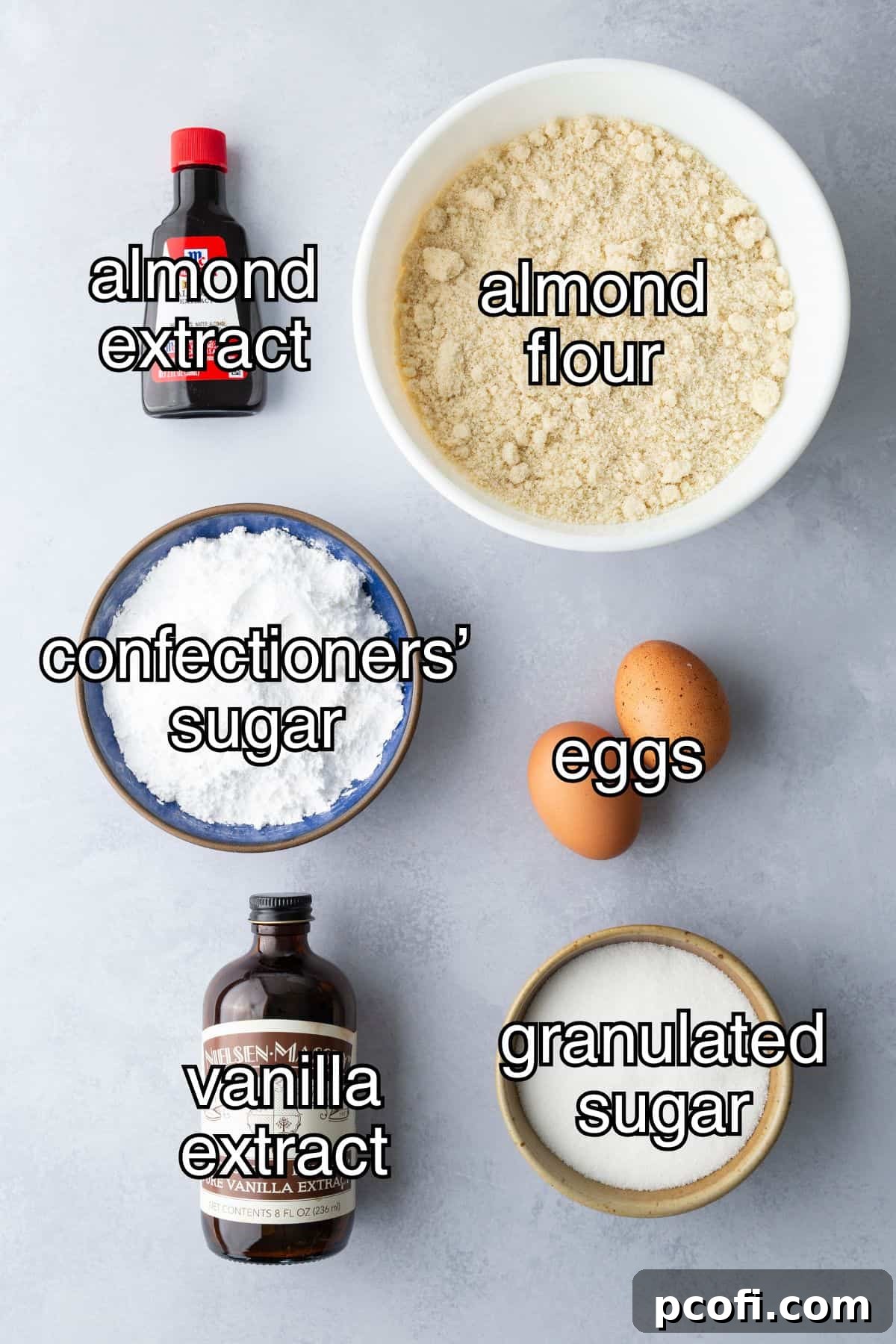 Recipe ingredients for amaretti cookies in separate containers.
