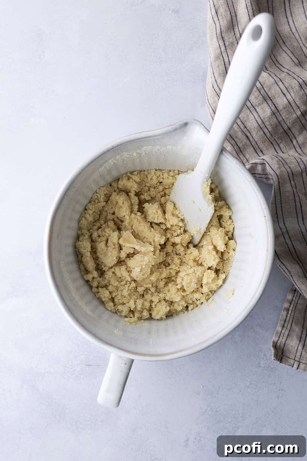 Wet and dry ingredients in a bowl after being mixed together.