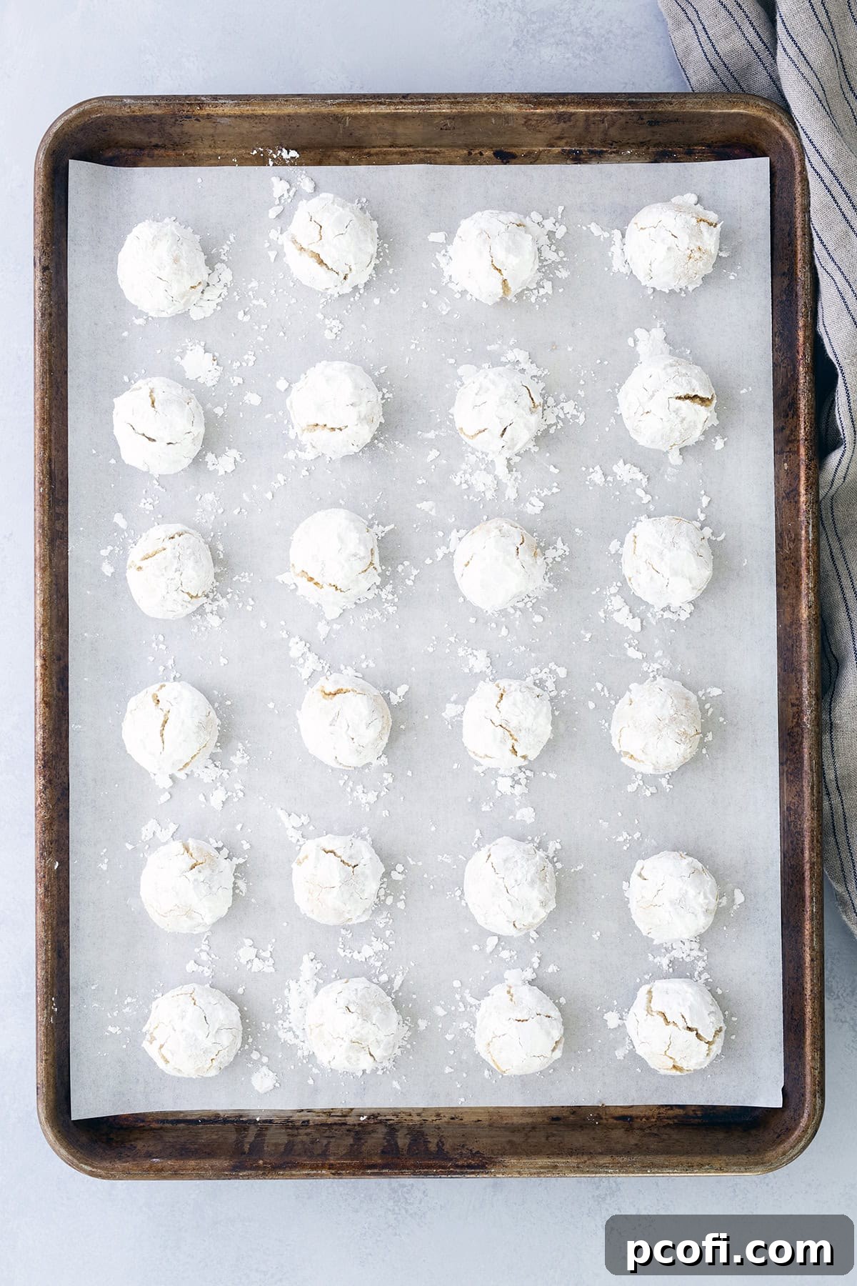 Baked cookies on baking pan cooling.
