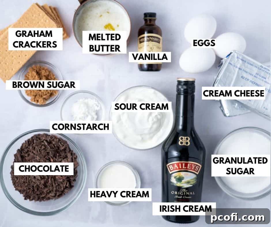 Assortment of fresh ingredients for Baileys cheesecake laid out on a table.