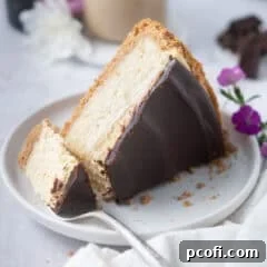Slice of Baileys cheesecake on a plate with a bite on a fork