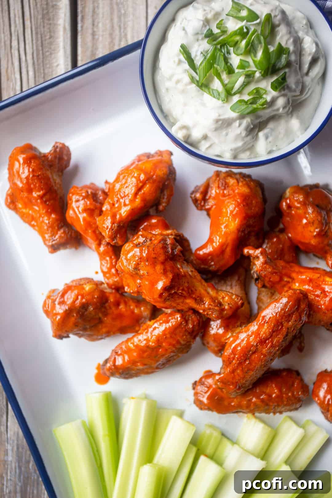 Crispy baked buffalo wings served with blue cheese dip and celery sticks.