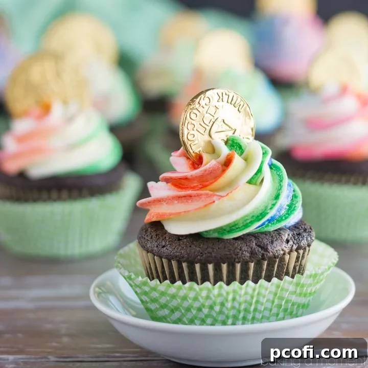 Whimsical Rainbow Pot of Gold Cupcakes with chocolate cake and rainbow frosting for St. Patrick's Day.