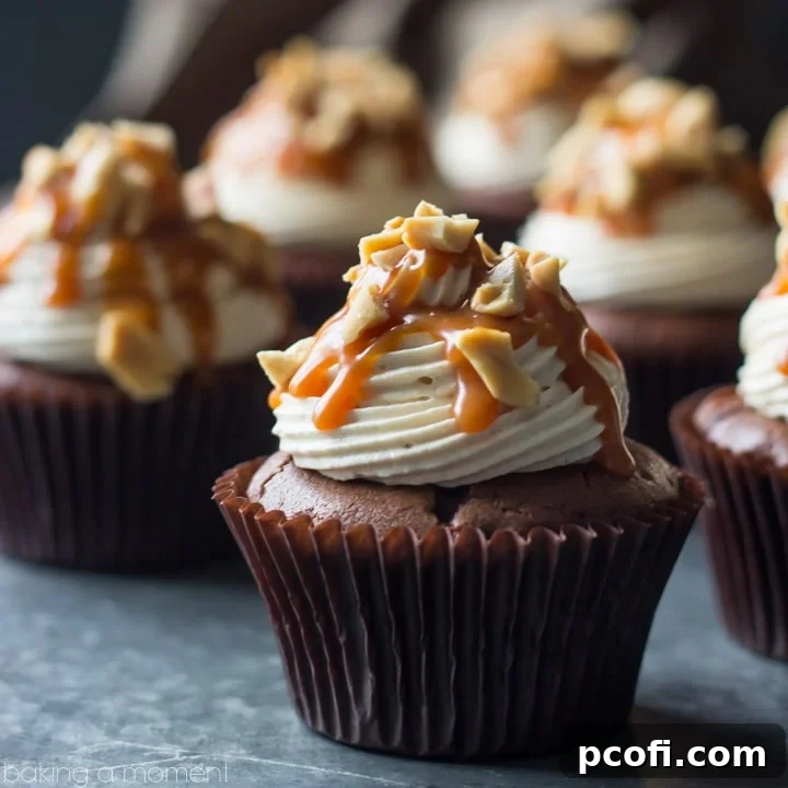 Snickers Cupcakes- best ever chocolate cupcake, topped with peanut butter buttercream, salted caramel, and peanuts. These were incredible!