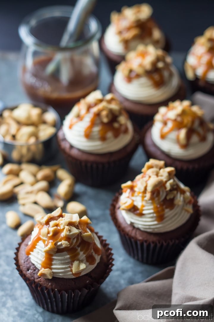 Snickers Cupcakes- best ever chocolate cupcake, topped with peanut butter buttercream, salted caramel, and peanuts. These were incredible!
