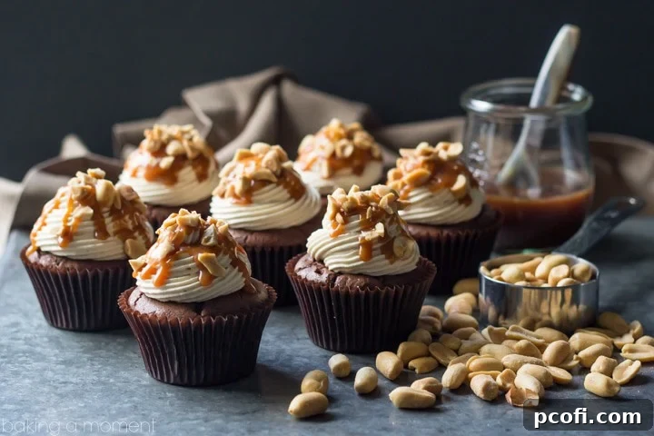 Snickers Cupcakes- best ever chocolate cupcake, topped with peanut butter buttercream, salted caramel, and peanuts. These were incredible!
