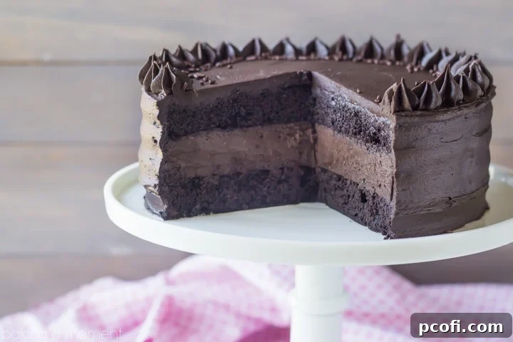 A slice of Brooklyn Blackout Cheesecake Cake, showing off its rich layers.
