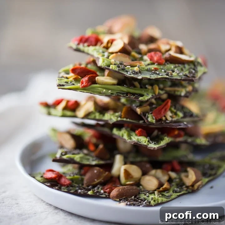This Dark Chocolate Almond Superfood Bark is loaded with healthy ingredients like matcha, goji berries, and chia seeds. Makes a great homemade holiday gift! 