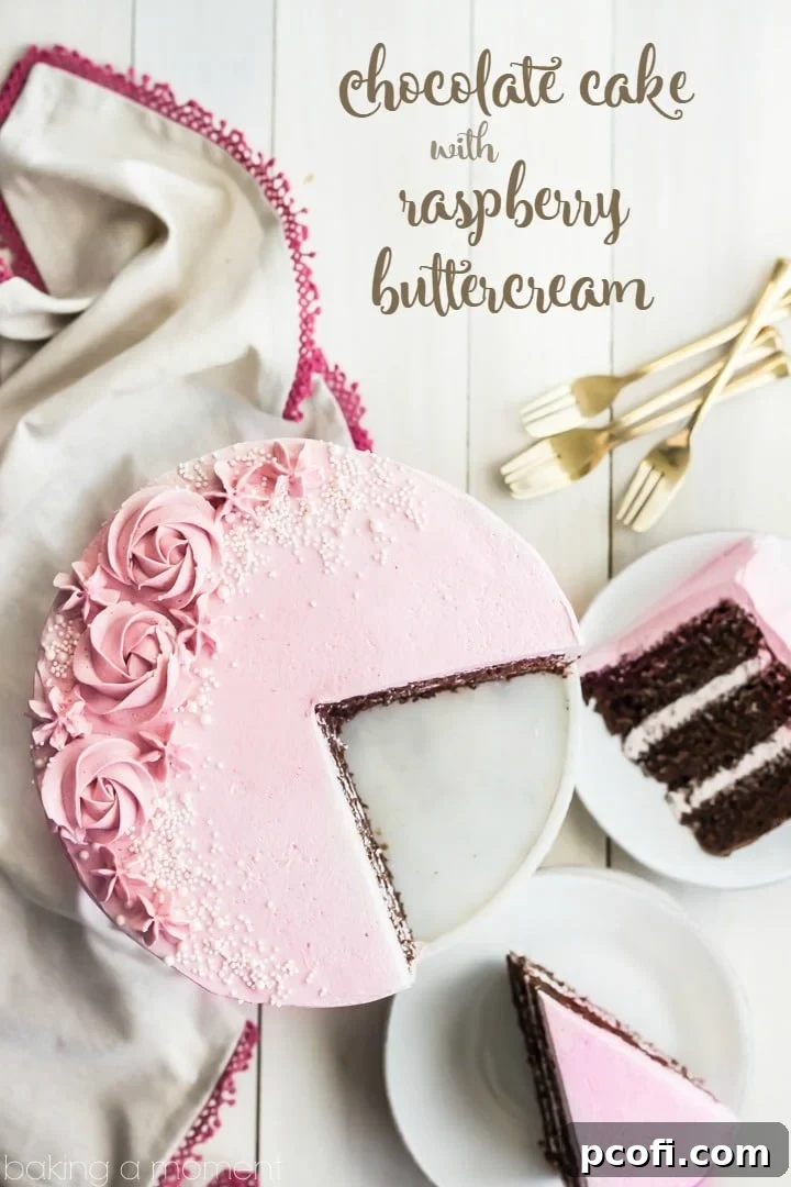 Close-up of a slice of moist chocolate cake with raspberry Swiss meringue buttercream, showcasing its fluffy texture and beautiful layers.