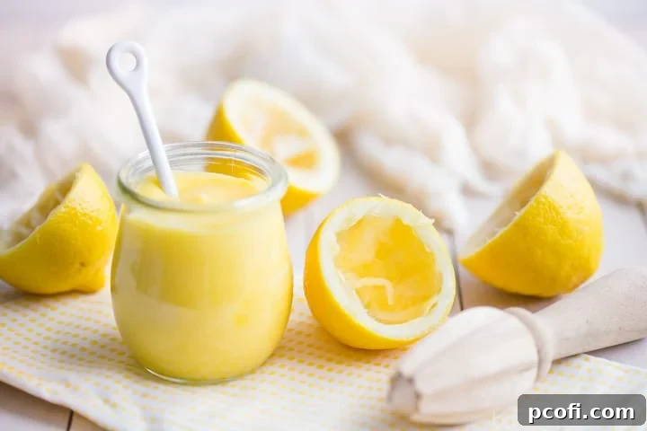 Homemade lemon curd in a jar, showcasing its smooth texture and vibrant color, ready to be enjoyed.