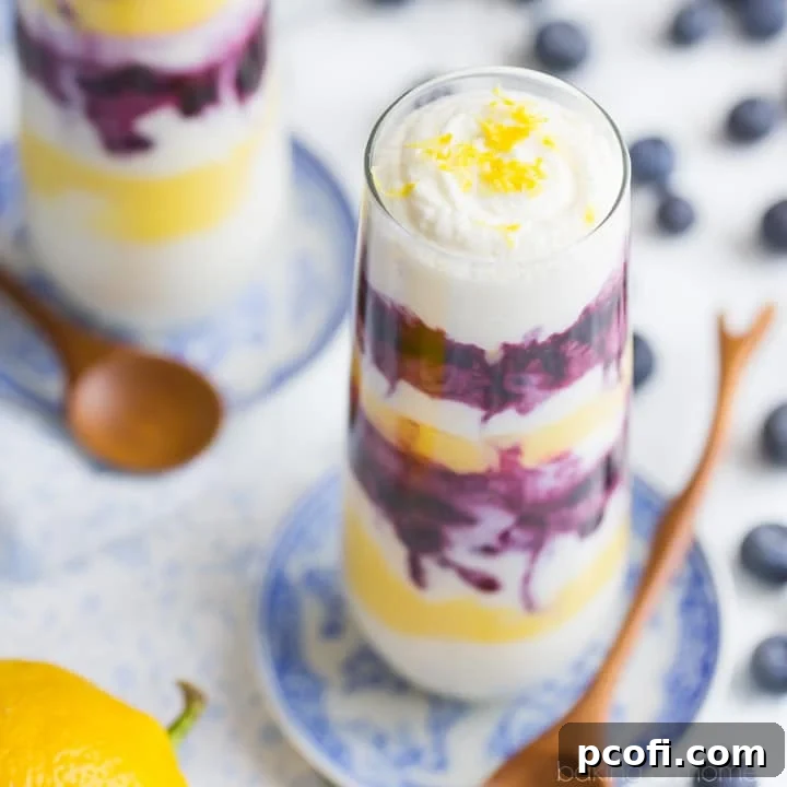 Bright and refreshing lemon blueberry parfaits layered in elegant glasses, perfect for a summer treat.