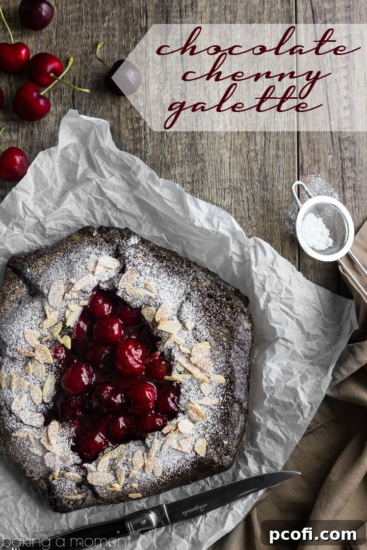 Close-up of a homemade Chocolate Cherry Galette, showcasing the flaky crust and juicy fruit.