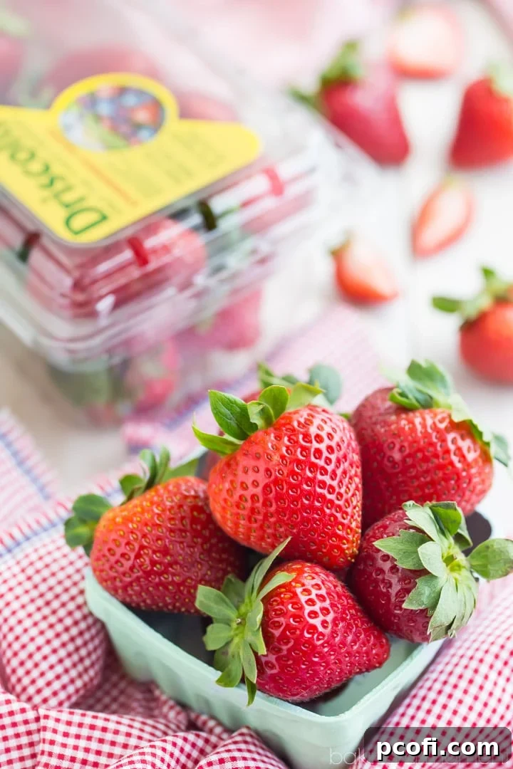 Homemade buttermilk biscuits for strawberry shortcake, topped with whipped cream