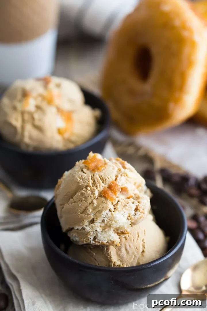 Close-up of Coffee and Donuts Ice Cream, showing the rich coffee color and embedded donut chunks.