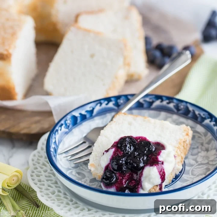 Classic Angel Food Cake: perfectly sweet & light as a cloud, served with fresh whipped cream and a citrus-y blueberry lemongrass topping.
