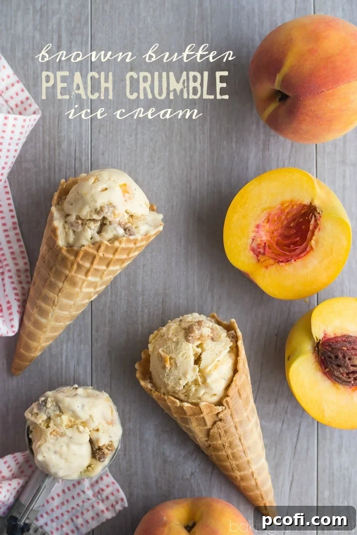Brown Butter Peach Crumble Ice Cream - A close-up shot revealing the creamy texture, visible peach pieces, and swirls of cinnamon streusel.