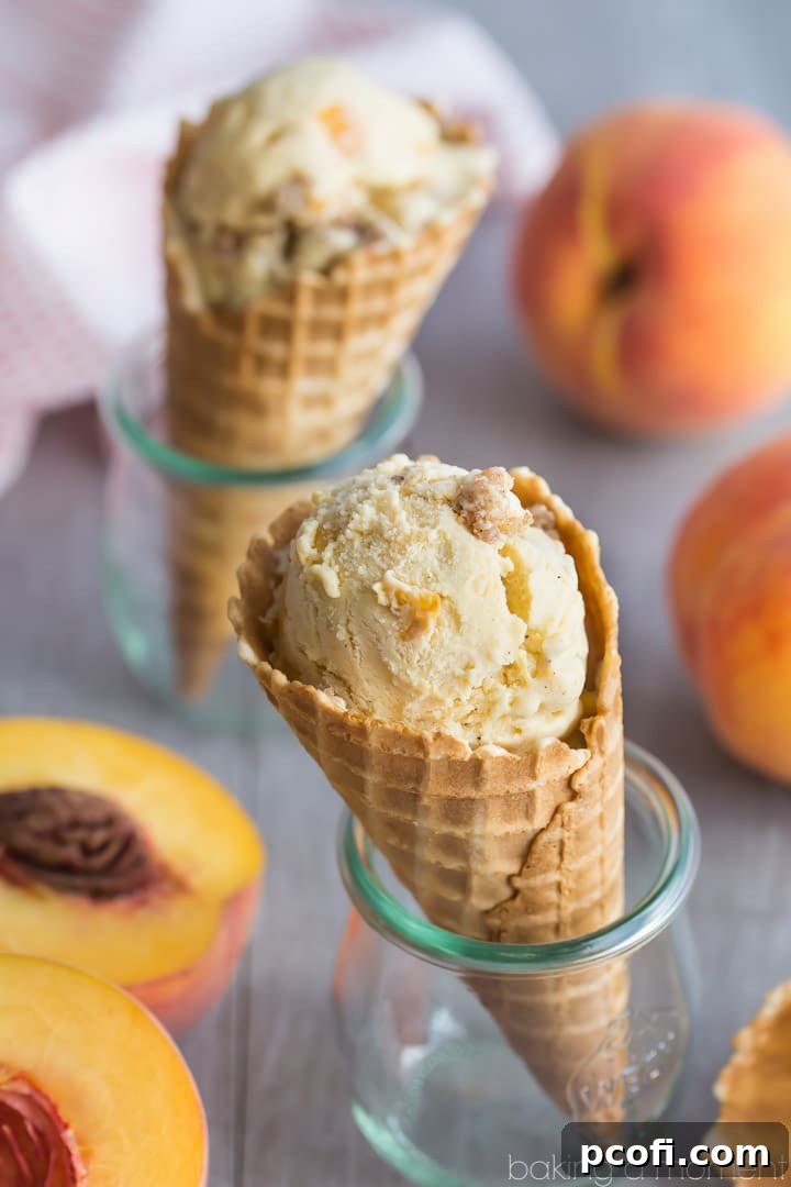 Brown Butter Peach Crumble Ice Cream - A serving of ice cream showing the distinct layers and swirl of streusel.