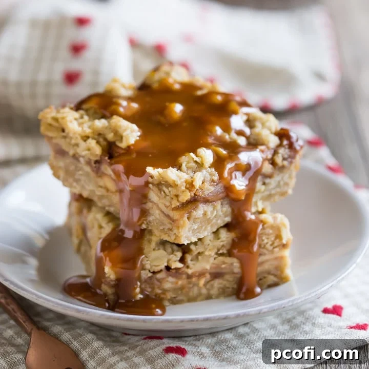 Delicious layers of chewy oatmeal cookie, cinnamon-spiced apples, and rich caramel sauce in a Caramel Apple Oatmeal Carmelita Bar, perfect for fall.