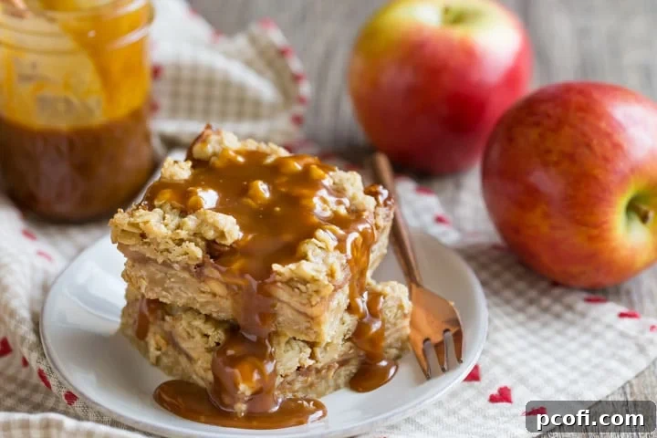 A serving of Caramel Apple Oatmeal Carmelita Bars, drizzled with extra caramel sauce, highlighting the rich and decadent layers.