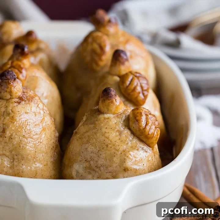 Tender baked pears wrapped in buttery pastry, swimming in a sweet cinnamon sauce – the ultimate fall comfort food.