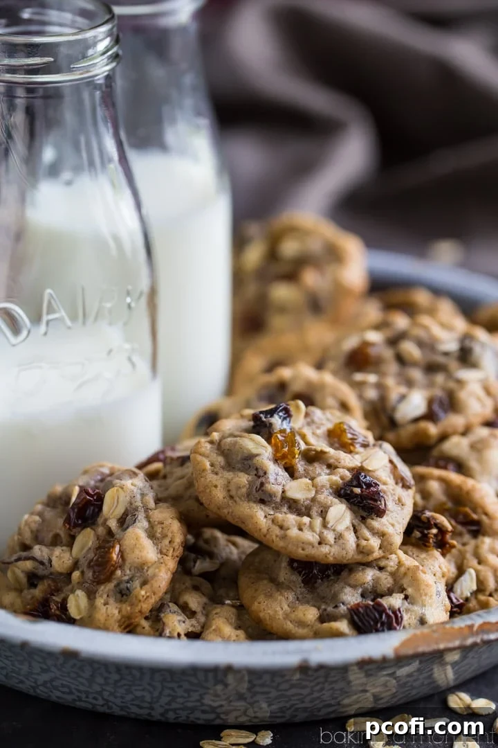 Delicious soft and chewy oatmeal raisin cookies, packed with a mix of sweet dark and golden raisins, and warm cinnamon spice.