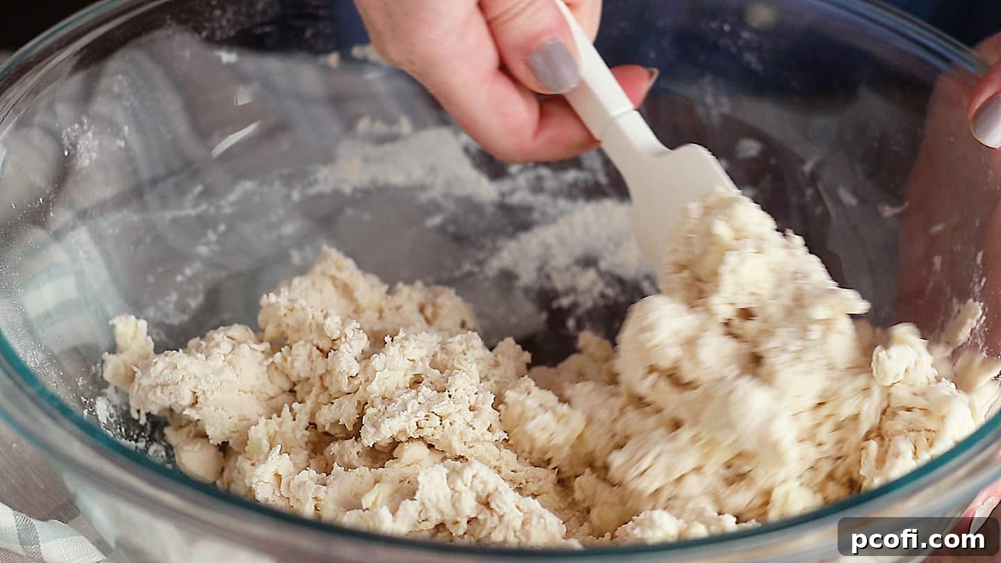 Kneading homemade buttermilk biscuit dough.