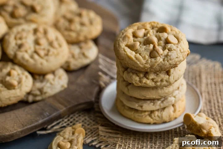 Freshly baked Soft Double Peanut Butter Chip Cookies cooling on a wire rack, waiting to be enjoyed.