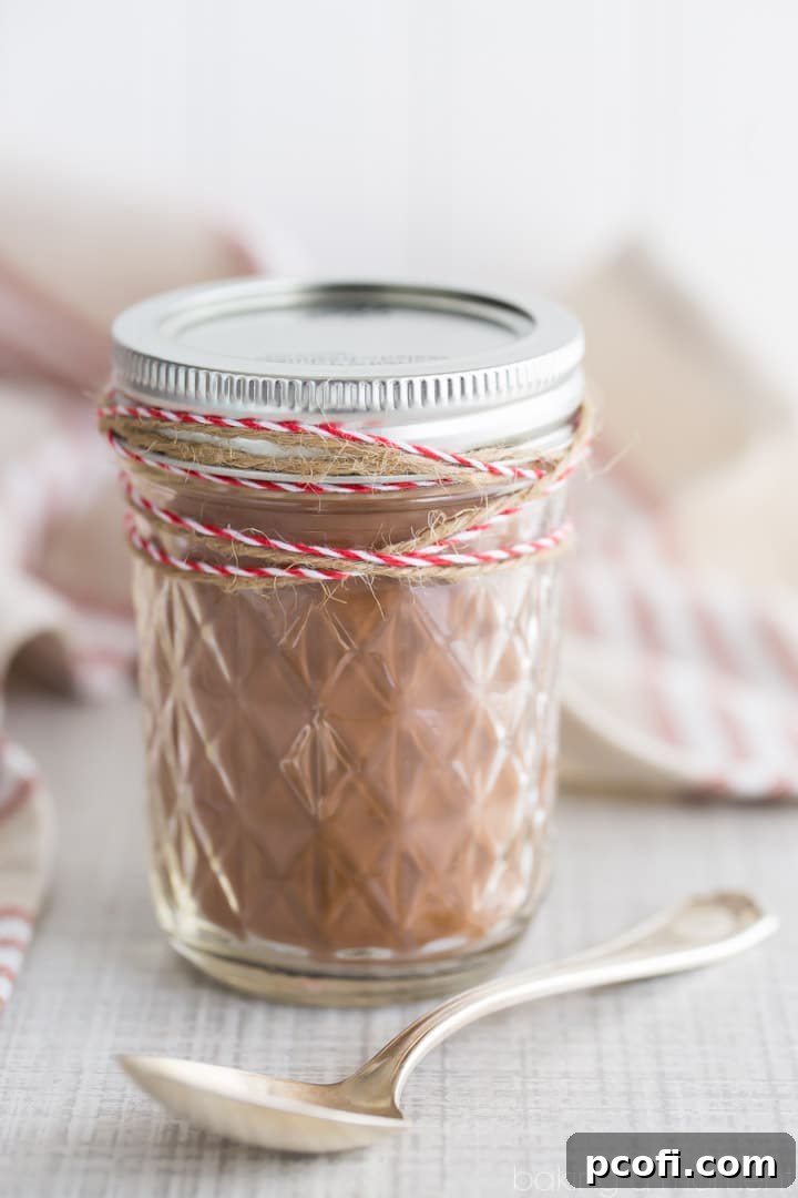 A beautiful jar of homemade Chile Mocha Mix, adorned with decorative twine, presented as an elegant and unique gift.