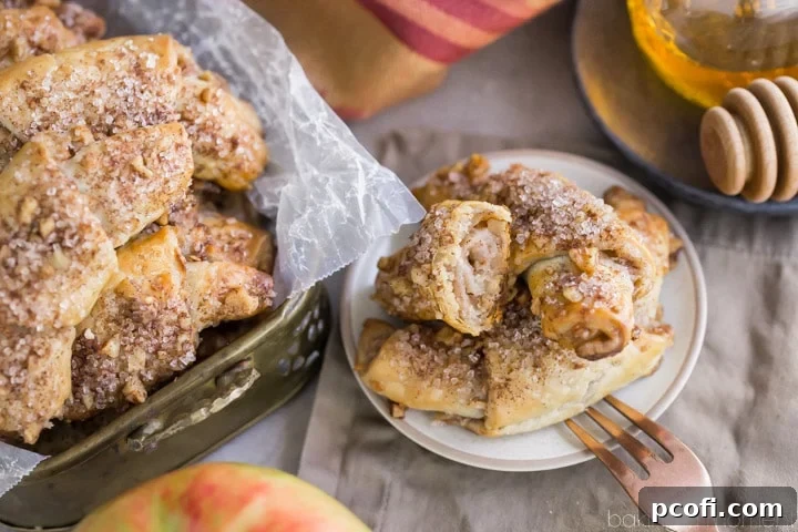 Apple Honey Rugelach: tender cream cheese pastries filled with charoset- an apple/honey/walnut mixture that's perfect for Rosh Hashana or any other fall occasion!