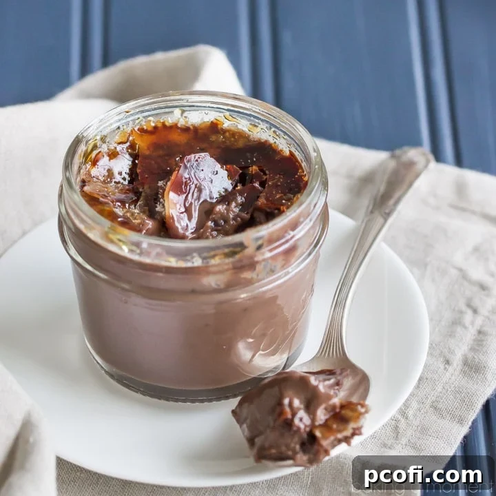 Rich chocolate creme brulee in a ramekin, garnished with cocoa powder