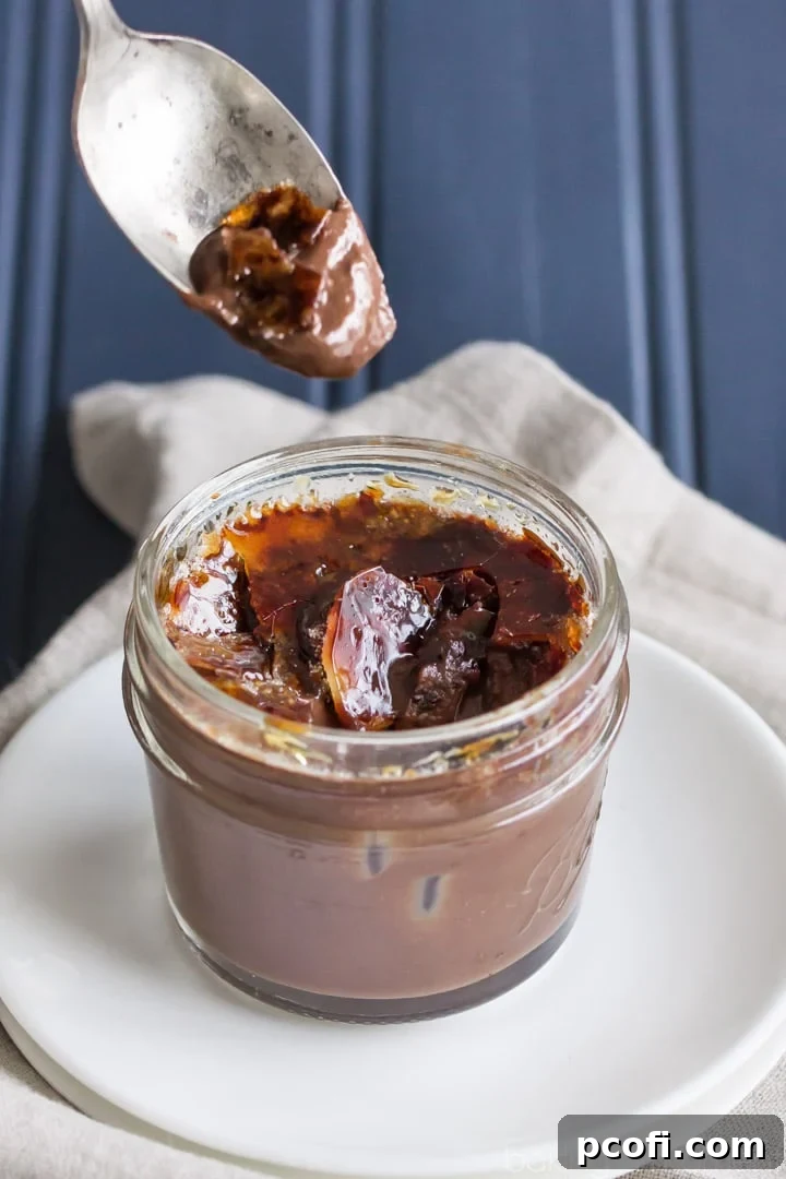 Preparing chocolate creme brulee in mason jars for baking in a water bath
