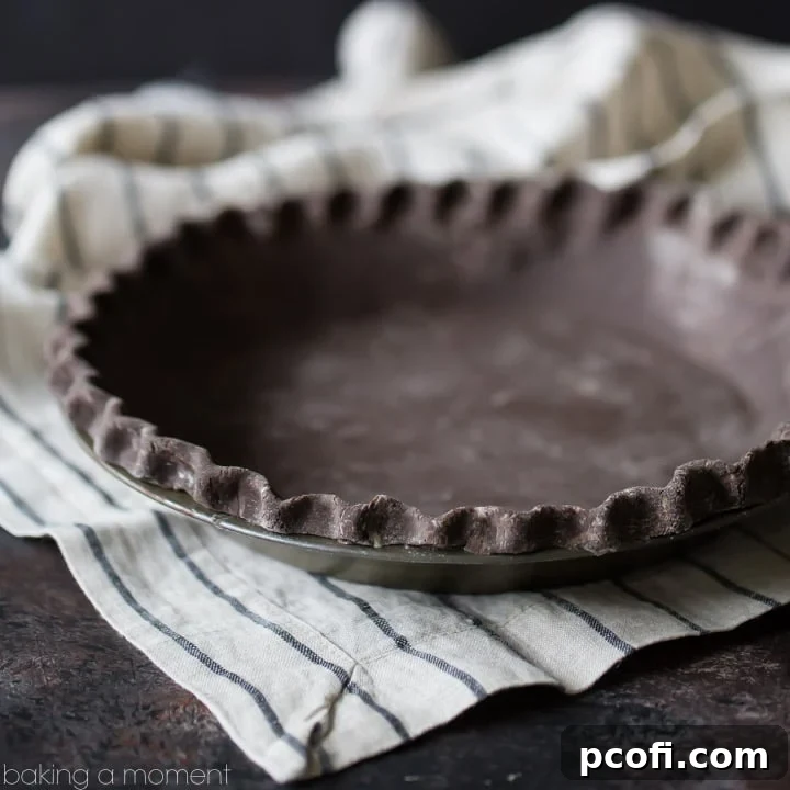 Rich, dark chocolate pie crust waiting to be filled, promising a decadent dessert experience. A true game-changer for holiday pies.