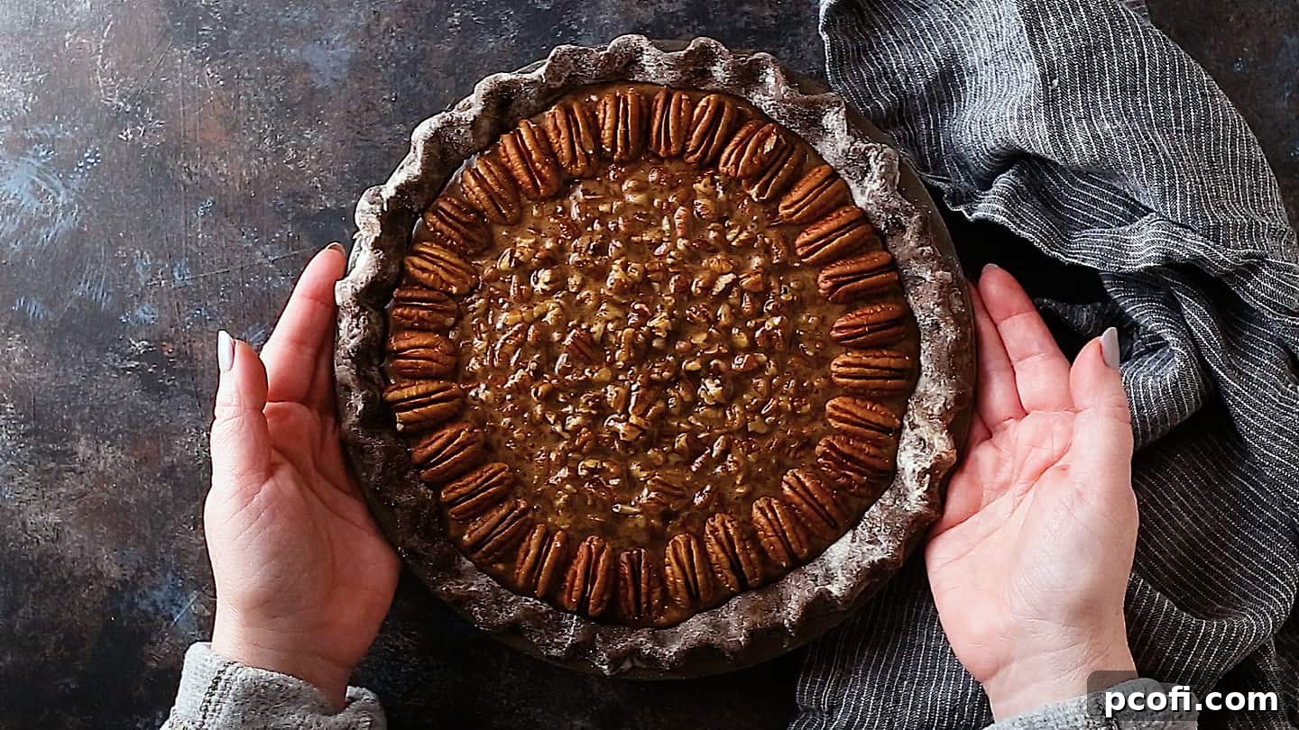 The unbaked Double Chocolate Pecan Pie, with its dark chocolate crust and rich pecan-filled interior, poised to enter the oven.