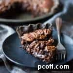Double Chocolate Pecan Pie recipe image showing a slice with rich filling.