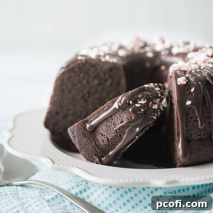 A decadent Chocolate Peppermint Bundt Cake, generously drizzled with chocolate ganache and sprinkled with crushed candy canes, perfect for festive holiday gatherings.