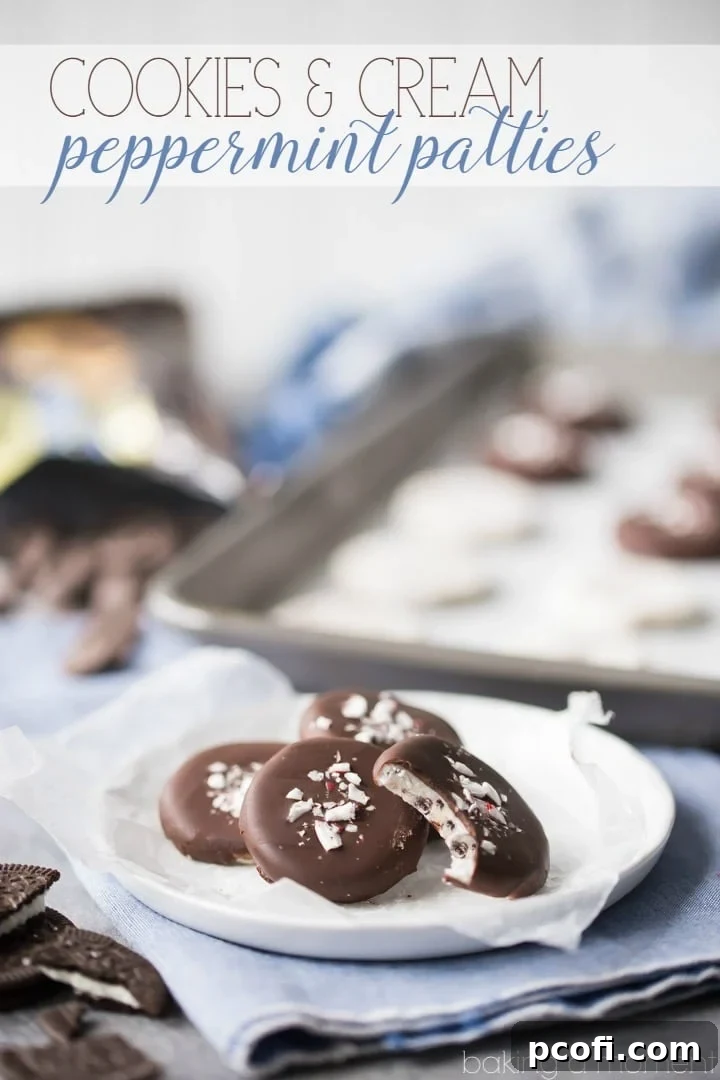 A vibrant display of completed cookies and cream peppermint patties on a white surface, showcasing their smooth chocolate coating and festive peppermint bark topping.