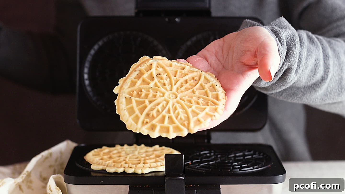Making pizzelle recipe in a pizzelle maker.