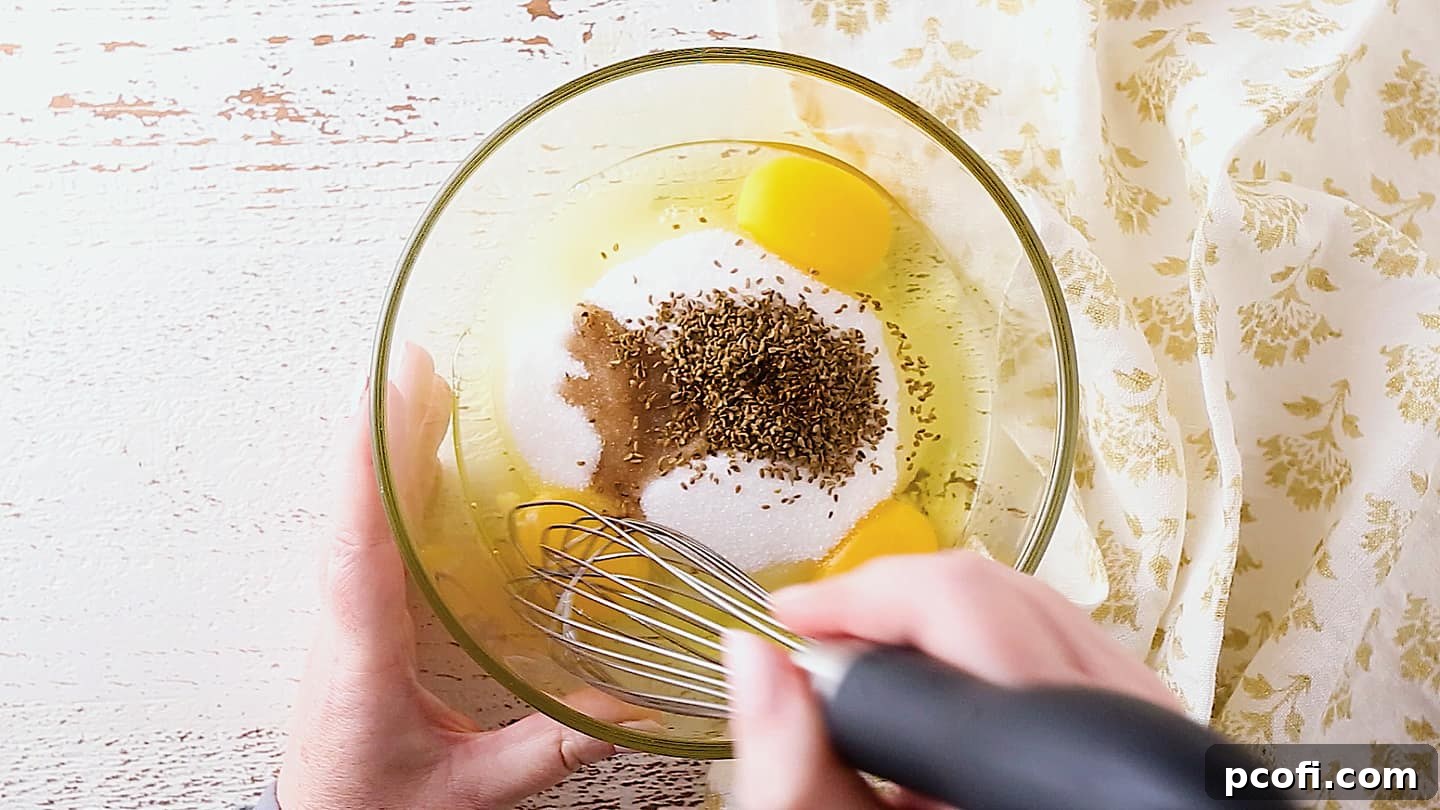 Making pizzelle with eggs, sugar, anise, and vanilla.