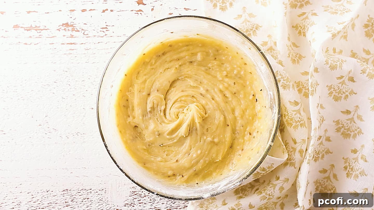 Batter for making pizzelle cookies, in a glass mixing bowl.