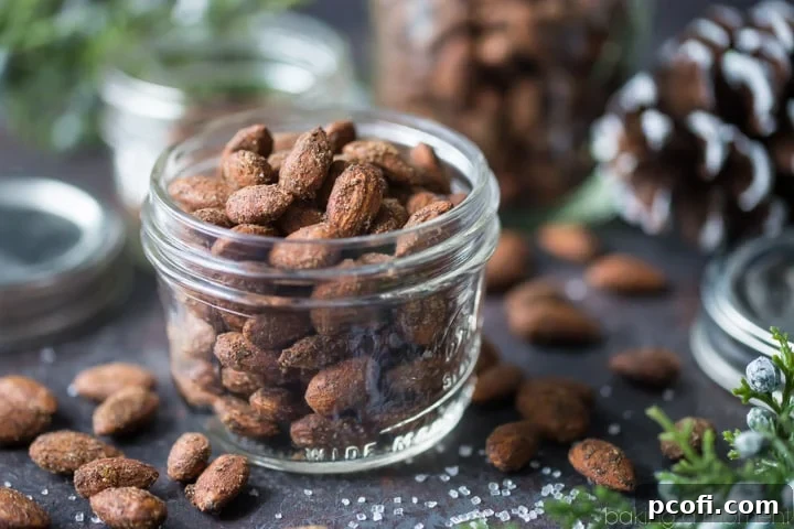 Close-up of baked Gingerbread Spiced Almonds, golden and coated with festive spices.