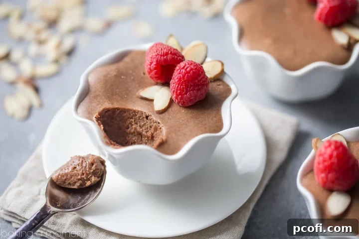 Ingredients laid out for a rich chocolate amaretto mousse, including semi-sweet chocolate, butter, eggs, and almond extract.