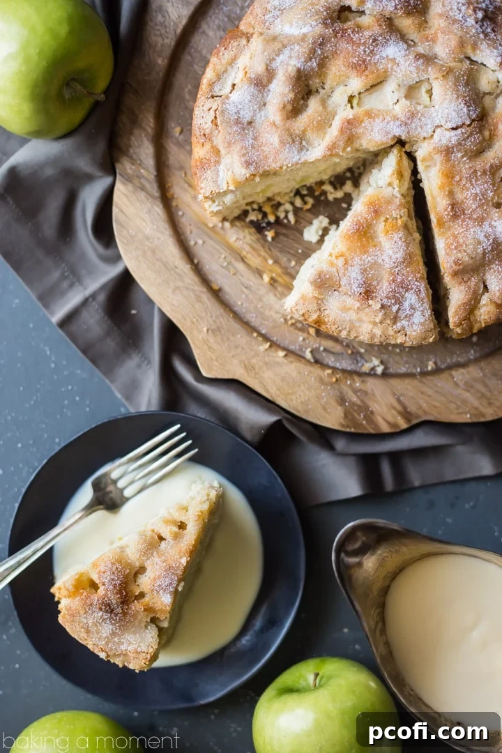A beautifully baked Irish Apple Cake, moist and full of apples, served with a creamy whiskey hard sauce. Ideal for St. Patrick's Day or any occasion.