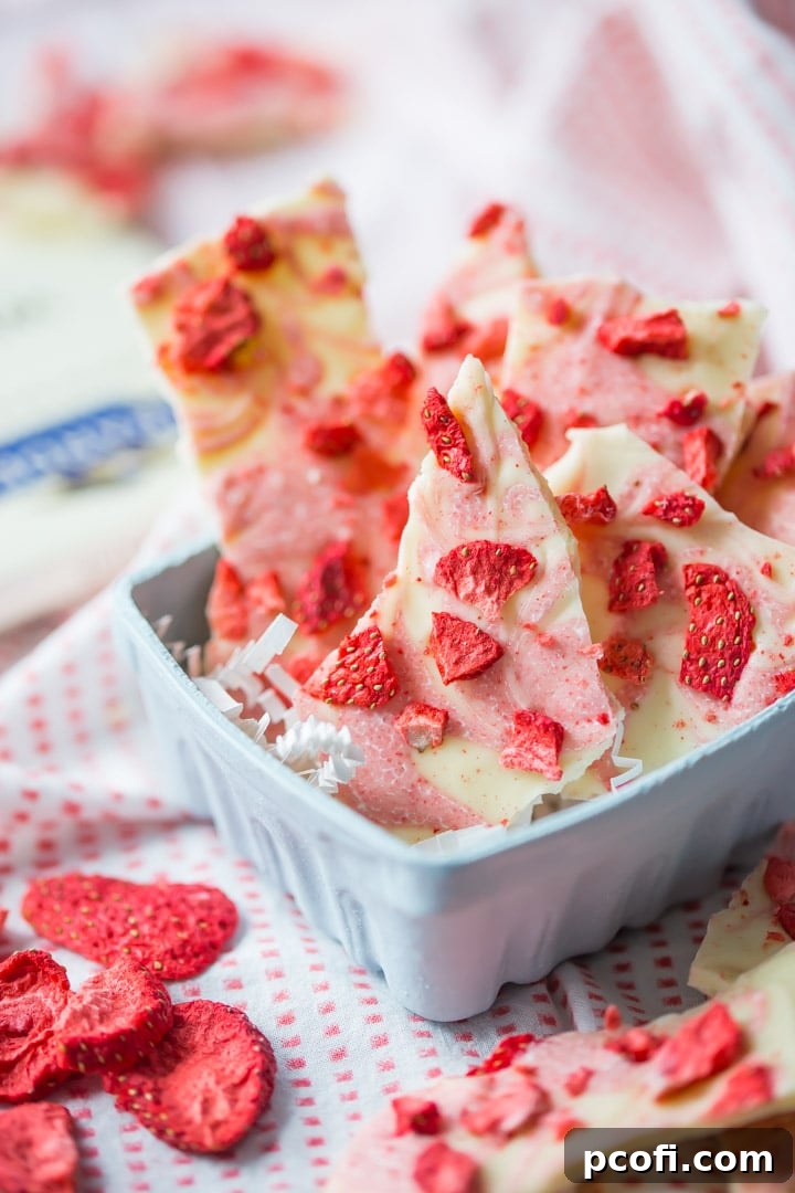 Strawberries & Cream White Chocolate Bark: So simple to make with intense strawberry flavor! Features Ghirardelli white chocolate. food desserts chocolate