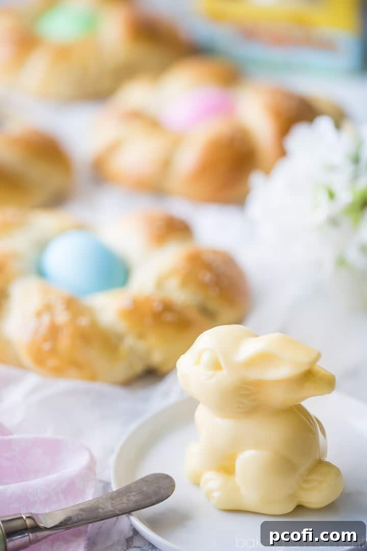 Easter Egg Bread: golden brown braided loaf with Easter eggs and a sweet butter sculpture in the shape of a bunny.