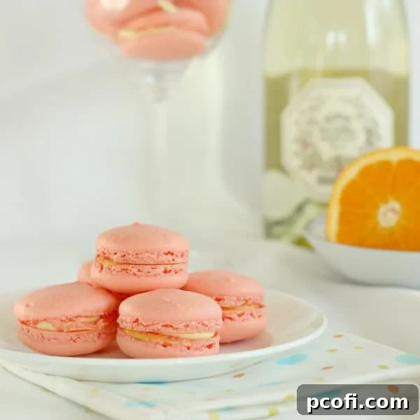 Delicious Mimosa Macarons stacked on a plate, perfect for Mother's Day brunch