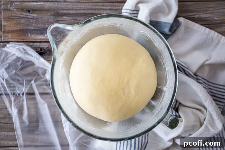 Sticky bun dough risen to twice its original volume.