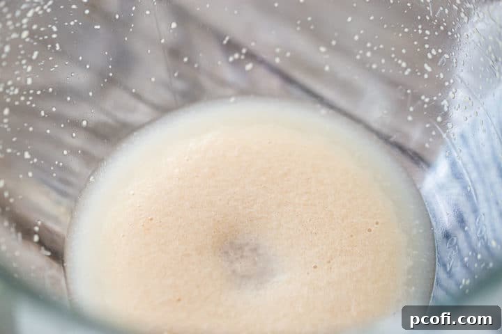 Foaming yeast in a glass bowl.