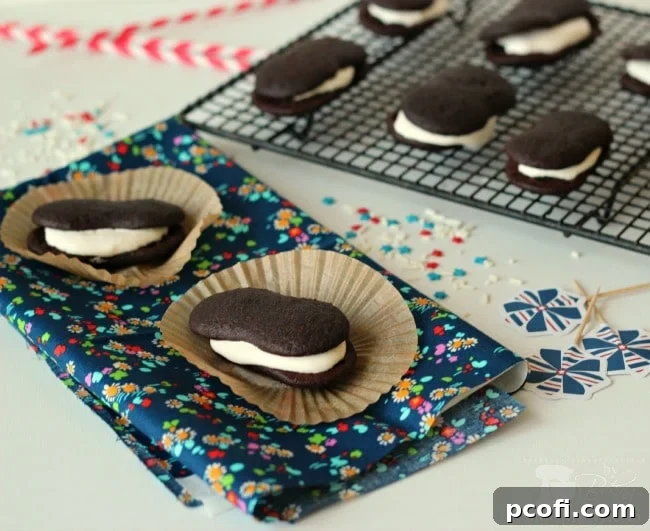 Fluffy marshmallow creme filling being spread on a devil dog cake