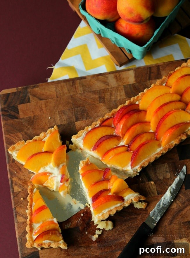 Slice of Peach Amaretto Cheesecake Tart on a Plate