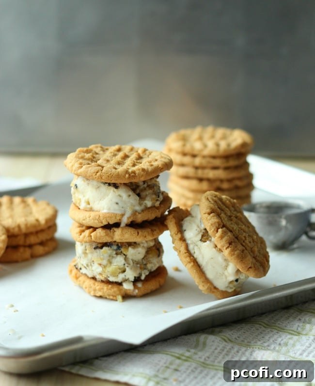 Stacked Thai Ice Cream Sandwiches showing the layers of cookie, ice cream, and pineapple.